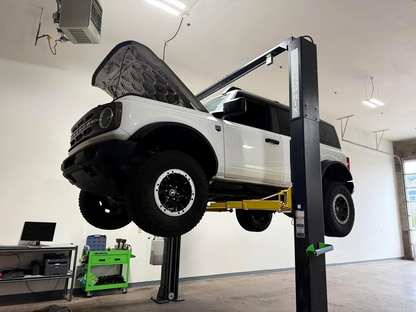 Vehicle raised on service lift